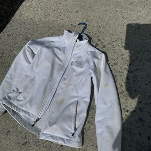 Small white north face has wear n year few stains